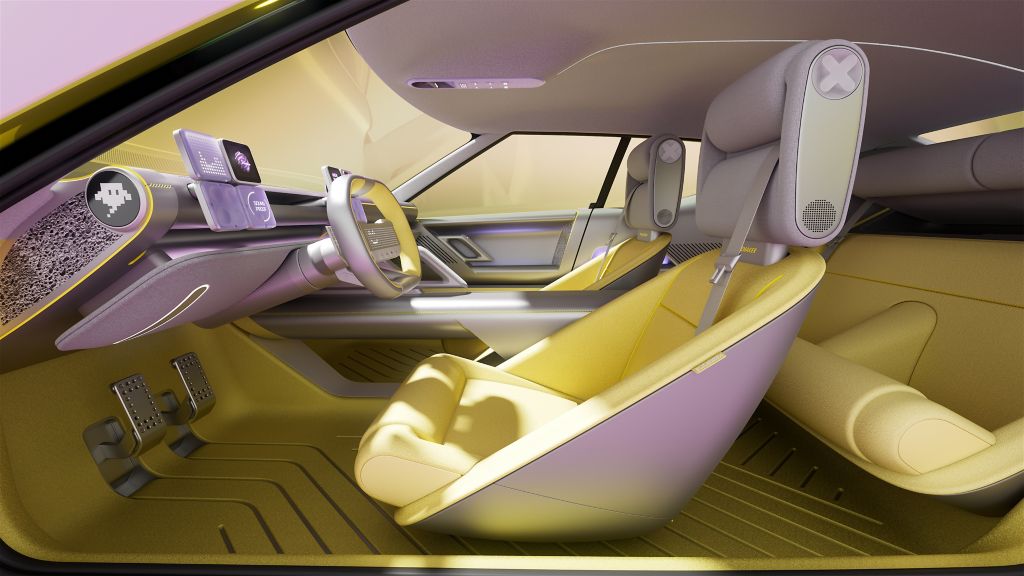 Intérieur du Hyundai Concept Three, avec habitacle jaune vif et interfaces numériques, préfiguration de la future Ioniq 3.